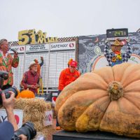 Grower Travis Gienger reacts to weighing of his winning pumpkin